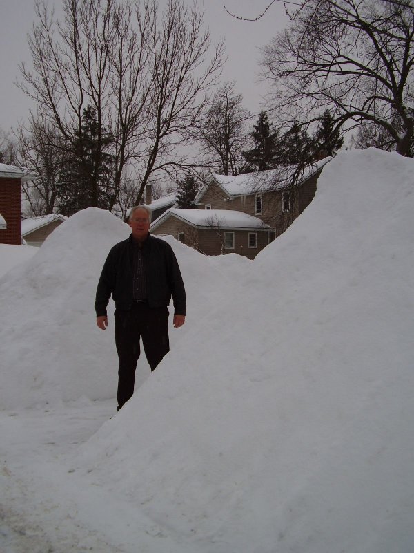 Ted stands between a couple of piles