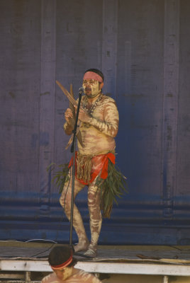 AN ABORIGINAL MUSICIAN ENTERTAINS THE CROWD AT THE ROAD OPENING