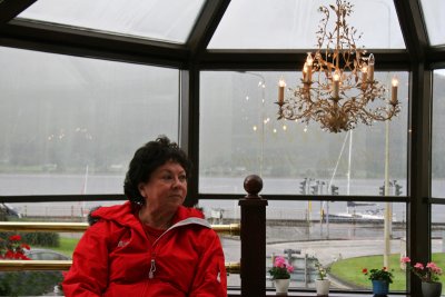 Juanita waits for the rain to stop at West End Hotel.