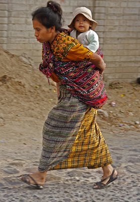 Mother Running Carrying Child