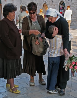 Boy Hugging Nun