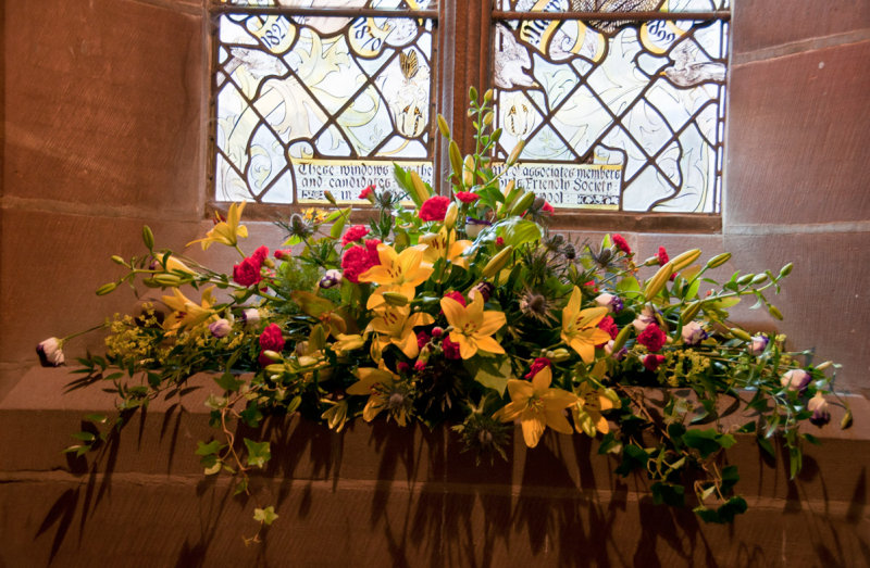 Fowers beneath the staircase famous women window