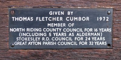 Inscription on the wooden seat