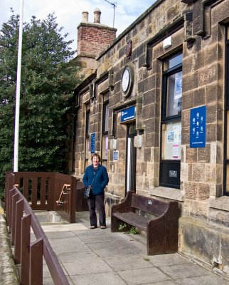 Carole outside her first school now a library