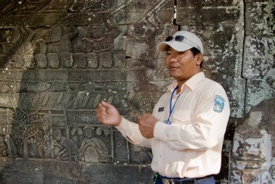  Our guide explaing the bas-relief murals which depict the history of Cambodia