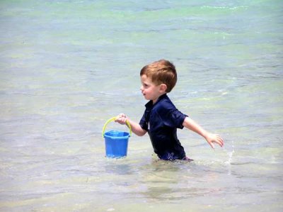Kid playing on Cockleshell Beach