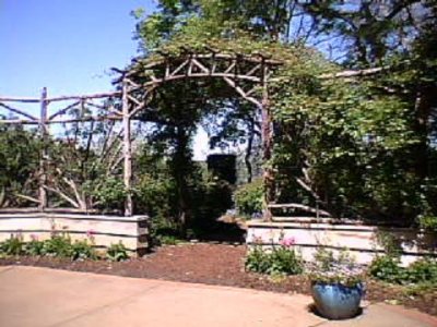 A vine arch like this would work in my garden.JPG