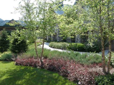 We enjoyed the gardens outside our patio room at Little River nearby.JPG