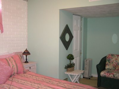 with closet and seating area, plus approx. 800 more sq.ft. of plumbed storage space with laundry tubs and cabinets.jpg