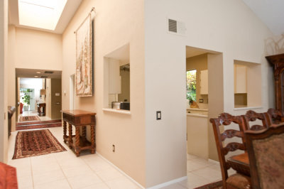 Hallway, entry to the kitchen and corner of the dining room