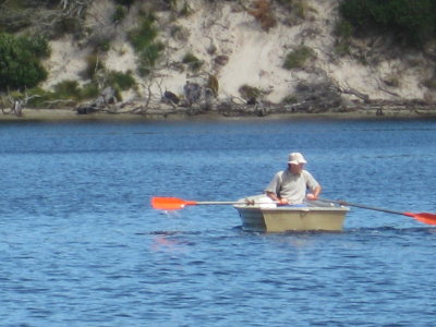 Michael rowing across New River Lagoon