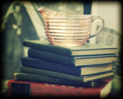 books with pink depression glass pitcher