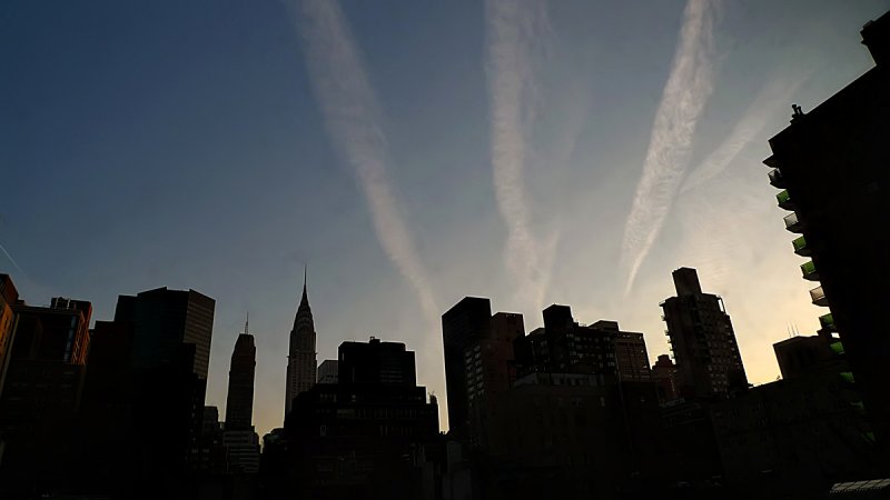 Contrails at dawn, New York City, New York, 2009