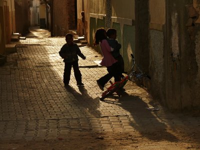 Minding little brother, Tozeur, Tunisia, 2008