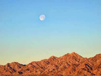 Moon setting at sunrise on Turtle Mountain