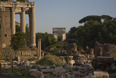 temple of antoninus and faustina with the arch of titus in the far background