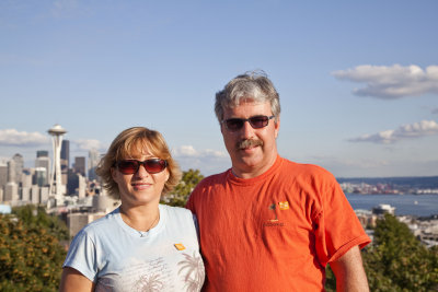 mike and dana at queen anne hill with seattle skyline in the background