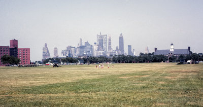View of Fort Jay Parade Ground and Lower Manhattan skyline in the background