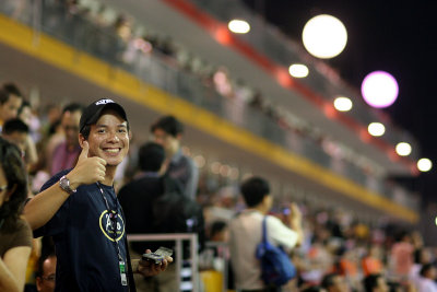 First timer watching a grand prix - you can tell by the smile!