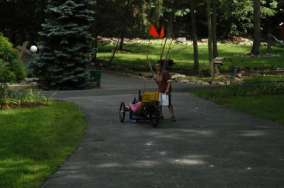 Kids riding my Trike in Driveway