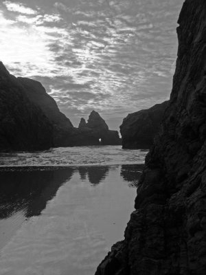 Hole in the rocks at Pistol River Beach bw