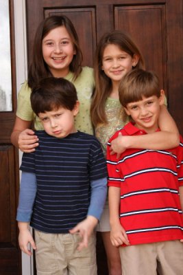 The 4 cousins -- one's not happy to pose