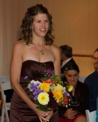 Erica Manteuffel the Maid of Honor walking up the aisle