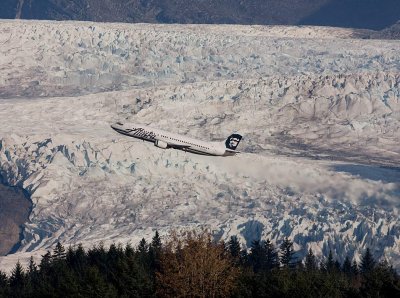 Alaska Airlines climbing out with Mendenhall Glacier in the background.