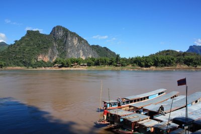 Long boats waiting to take tourists back to Luang Prabang