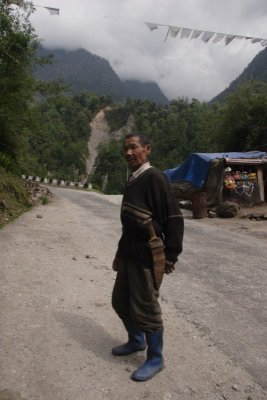 A Sikkimese man showing off his  kukri (knife)