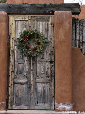 Wooden door with wreath