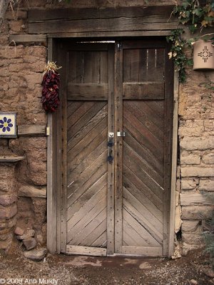 Wooden door with ristra