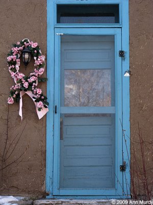 Turquoise door and pink roses