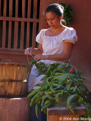 Vivian stringing green chiles