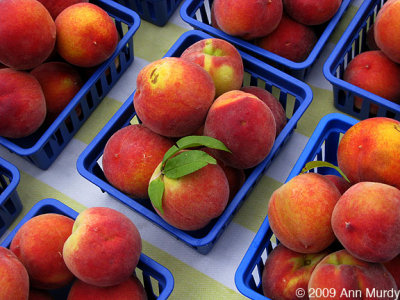 Peaches in blue trays