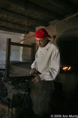 Larry in the blacksmith shop