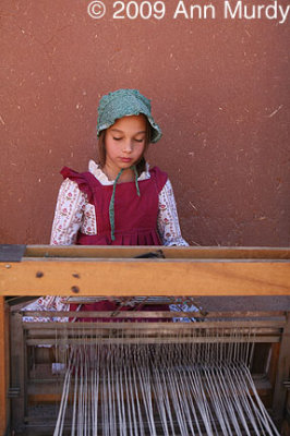 Little girl weaving
