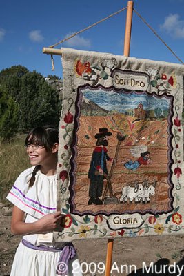 Estrella holding banner
