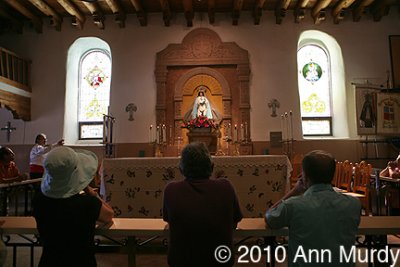 Praying to La Conquistadora