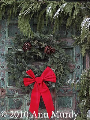 Green door with wreath