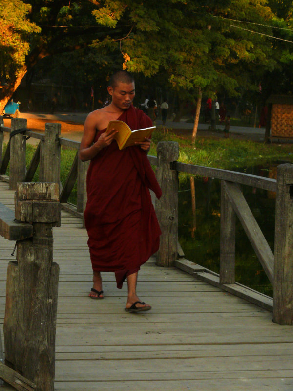 Reading monk on bridge Mandalay.jpg