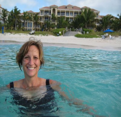 Galina floating in the water-Villa Renaissance in the background