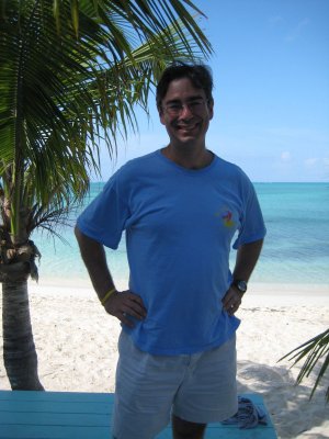 Rich poses at the Conch Shack-beach in background