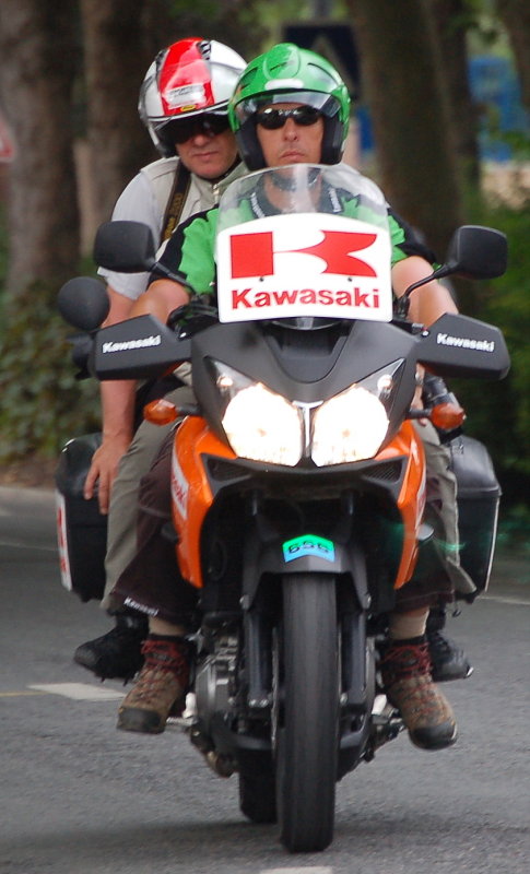 one of the many tour photographers that spend eight hours on the back of a bike