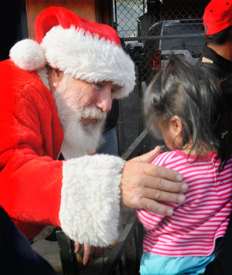 santa greeting needy kids