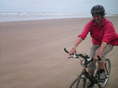 Ursula cycling along the beach to the wreck.jpg