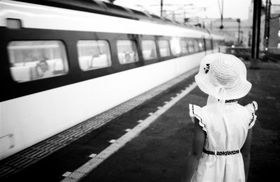 Girl Watching Tokyo-Bound Train on Shinkansen Platform