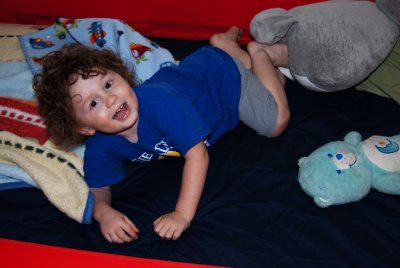 Aidan excited about his new race car bed DSC_3968.JPG