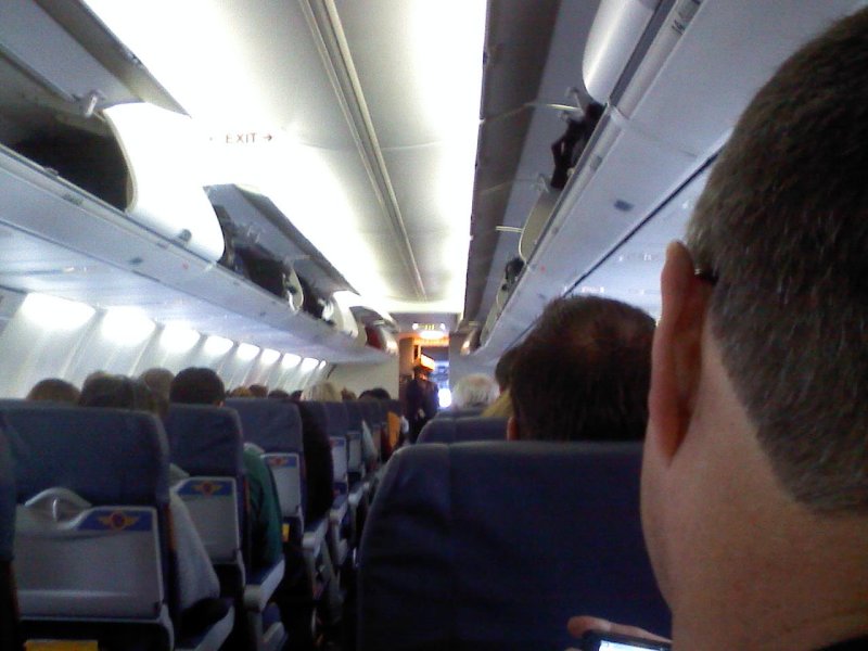 Flight Attendant Wears My Cheesehead to Greet Passengers