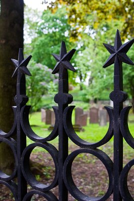 Looking through the cemetery fence